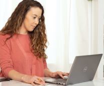 Female Office Worker Sitting At A Desk Typing On A Laptop, Graphic